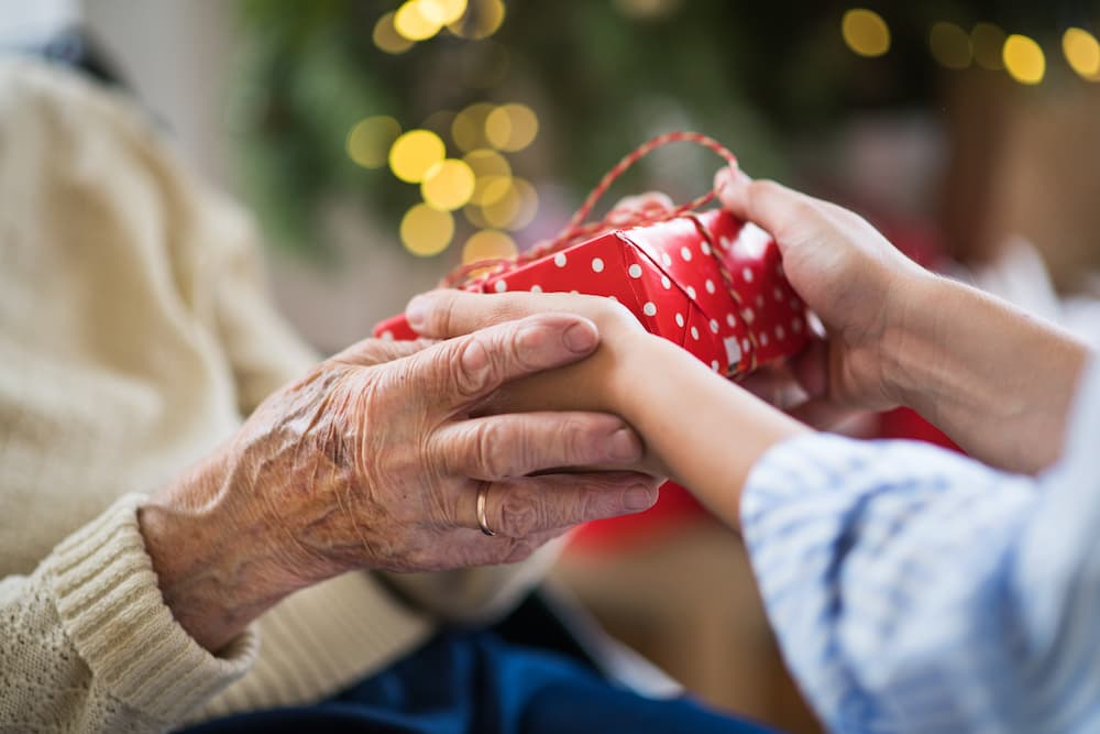 seniors giving gifts during the holidays